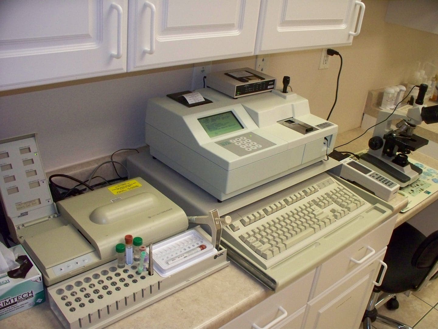 A desk with many different computers on it