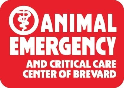 A red background with white lettering that says animal emergency and critical care center of brevard.